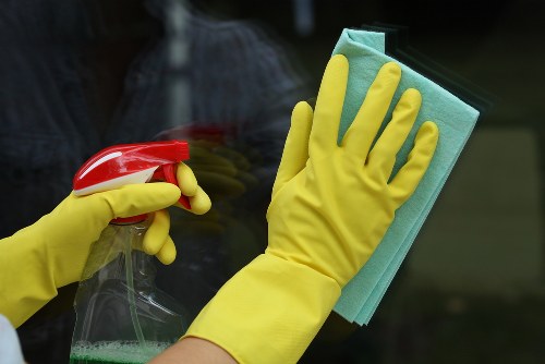 Commercial cleaning team working in a SW5 office entrance