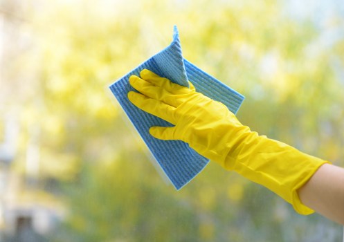 Window cleaner working on a residential property in SW5