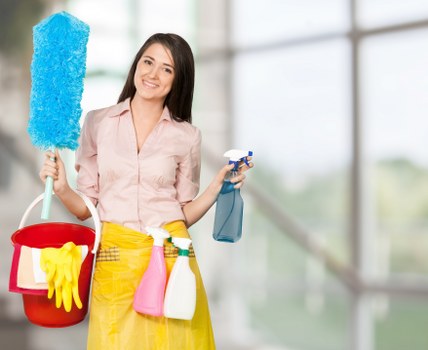 Cleaning professional inspecting carpet fibres before treatment