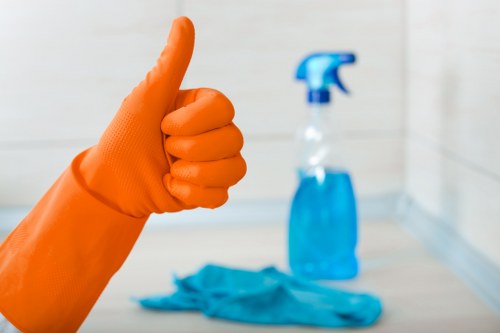 Technician operating carpet cleaning equipment during a service